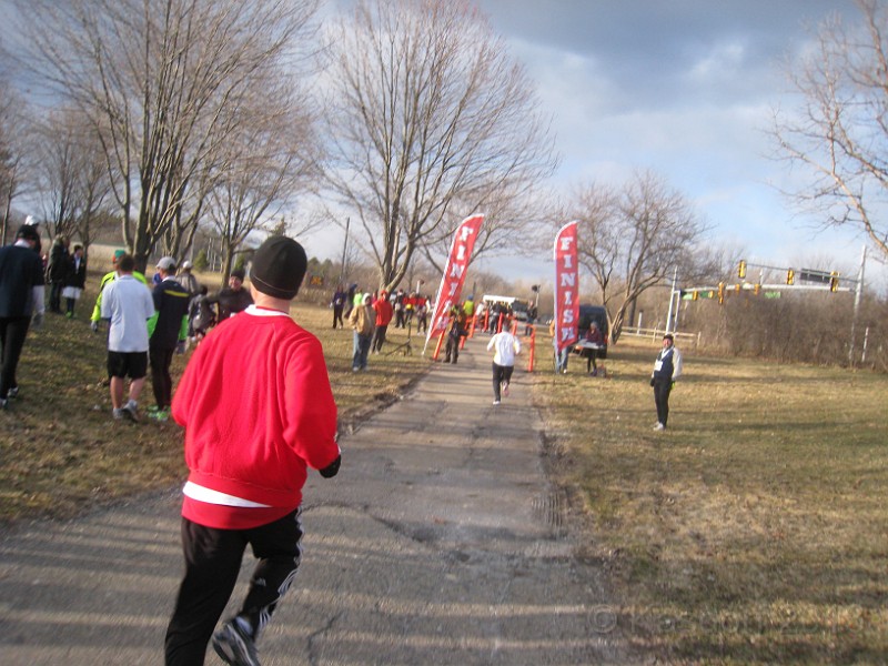2013 Twinkie 5K 44.JPG - The 2013 Twinkie 5K. This is run on April Fools Day (April 1) every year. It is run in Ann Arbors Gallup Park. This year was a very cold and windy evening. (It is run at 6:15 pm)